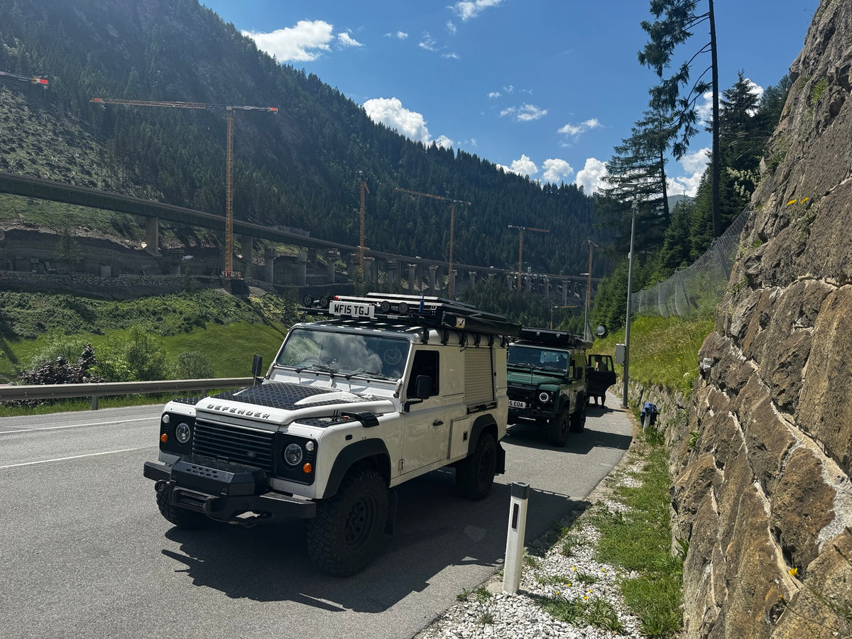 Criddle Overland Land Rover Defenders travelling through the Alps